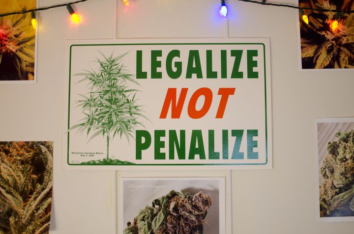 A pro-marijuana legalization poster is seen hanging in a back room where vaporizing cannabis is allowed at The Green Buddha May 22, 2012 in Seattle, Washington. Photo by Daniel Berman.